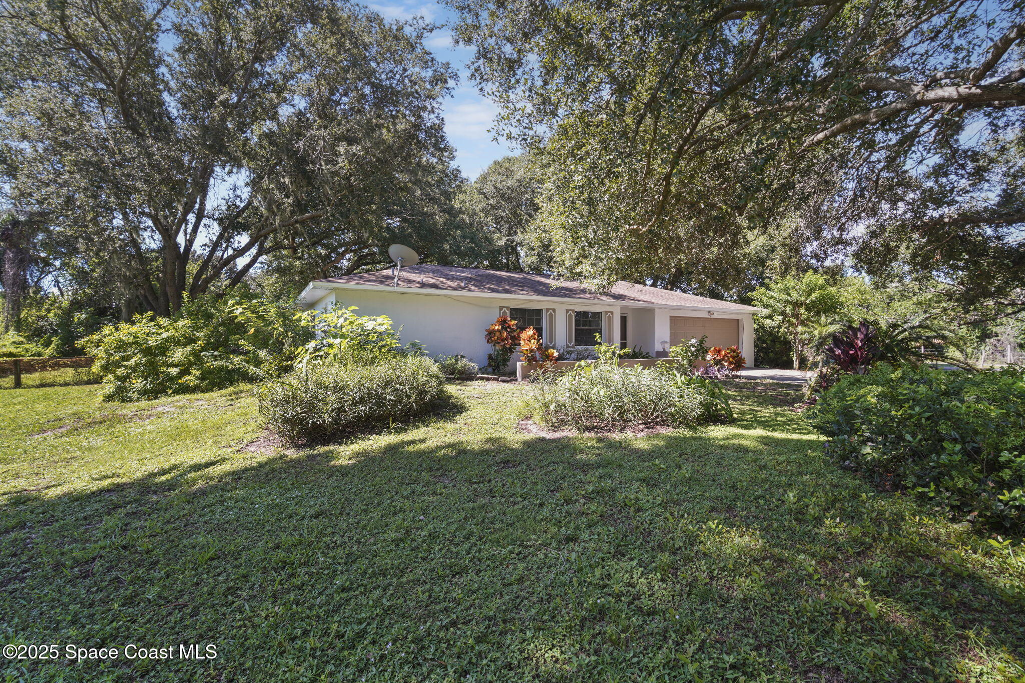 3125 Lionel Road Mims, FL 32754 - Photo 3 of 31 a front view of house with yard and green space