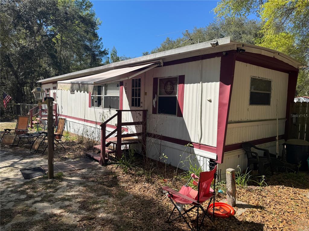208 Lakeview Road Melrose, FL 32666 - Photo 1 of 1 a front view of a house with balcony