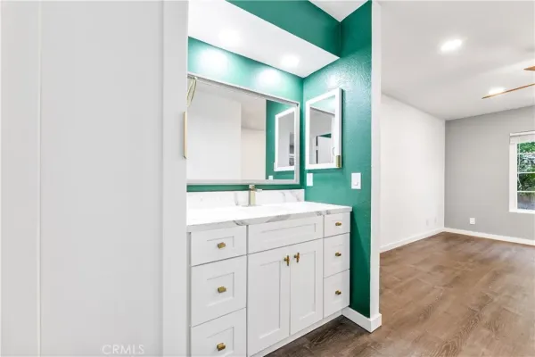 a bathroom with a double vanity sink and mirror