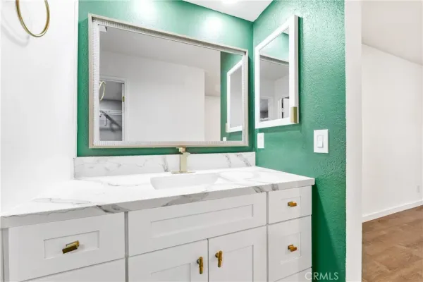 a bathroom with a sink and a mirror