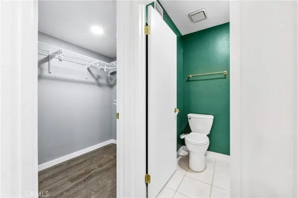 a view of a bathroom with a toilet
