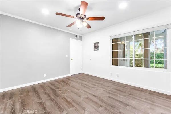 a view of an empty room with a window