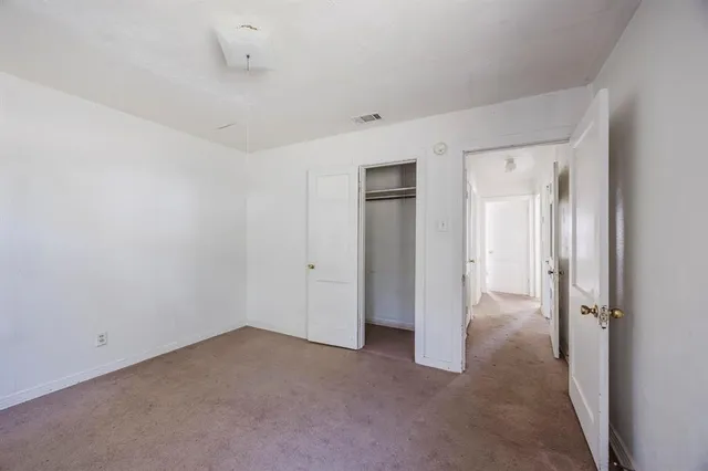 a view of a room with a hallway