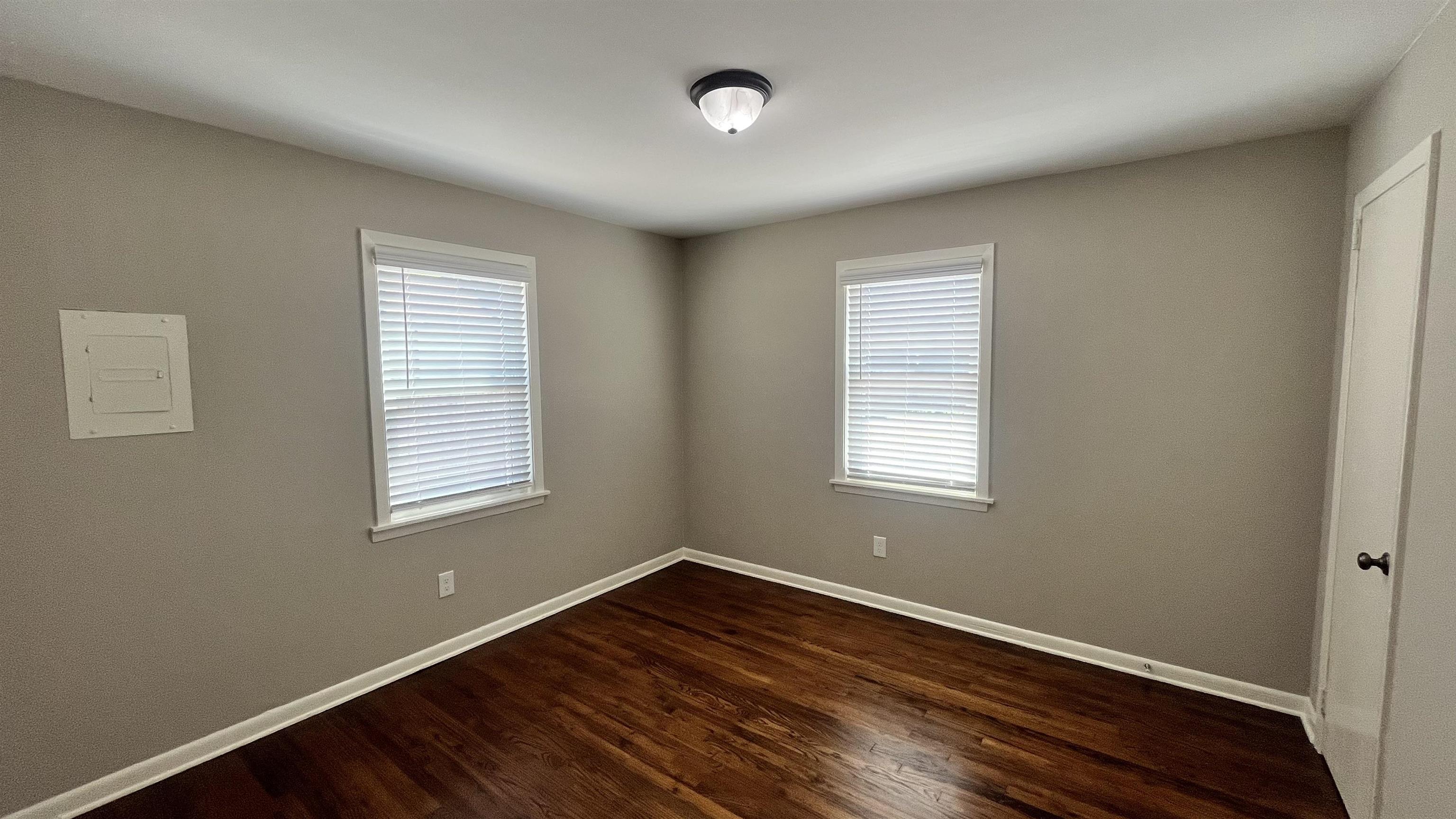 121 West Street Collierville, TN 38017 - Photo 11 of 16 a view of an empty room with wooden floor and a window