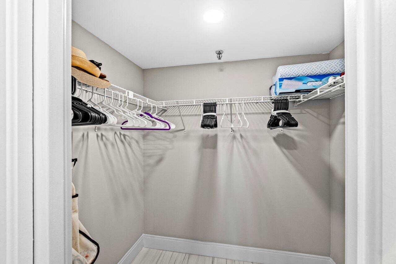 899 Jeffery Street, Unit 2120 Boca Raton, FL 33487 - Photo 20 of 38 a walk in closet with wooden floor