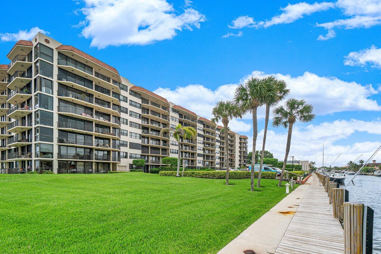 899 Jeffery Street, Unit 2120 Boca Raton, FL 33487 - Photo 34 of 38 a view of a building with a yard