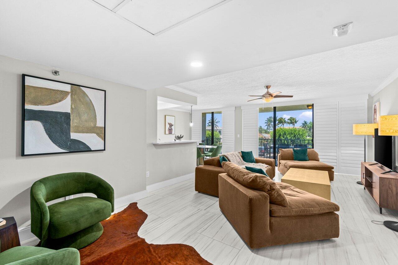 899 Jeffery Street, Unit 2120 Boca Raton, FL 33487 - Photo 4 of 38 a living room with furniture ceiling fan and a window