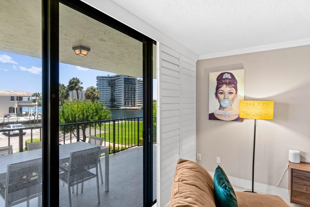 899 Jeffery Street, Unit 2120 Boca Raton, FL 33487 - Photo 6 of 38 a view of a living room and a balcony