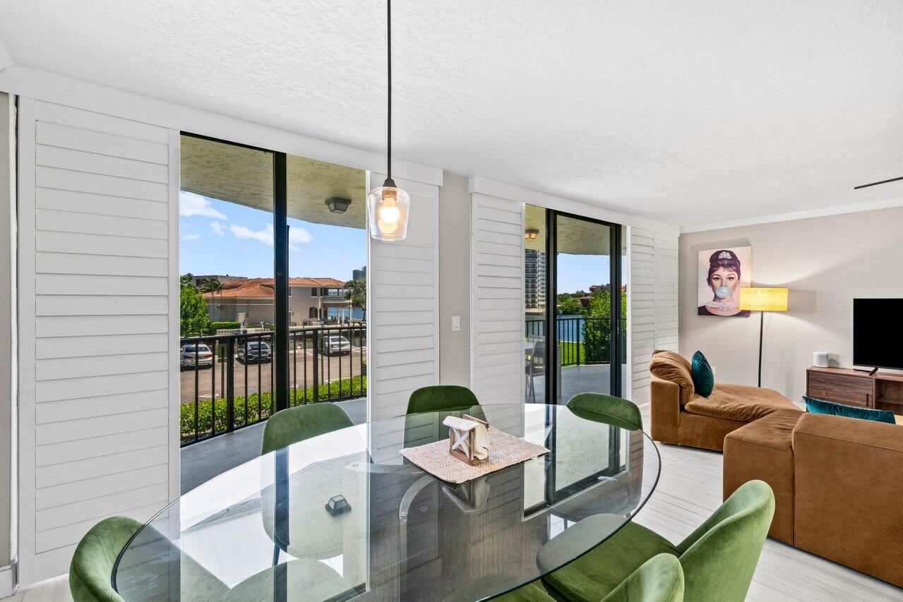 899 Jeffery Street, Unit 2120 Boca Raton, FL 33487 - Photo 10 of 38 a living room with furniture and a floor to ceiling window