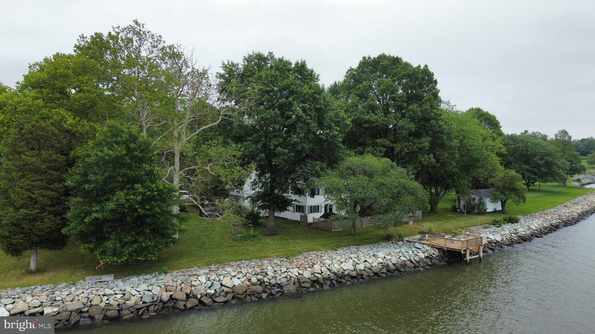 6225 Sandy Point Road Prince Frederick, MD 20678 - Photo 1 of 45 an aerial view of a house with a yard and lake view