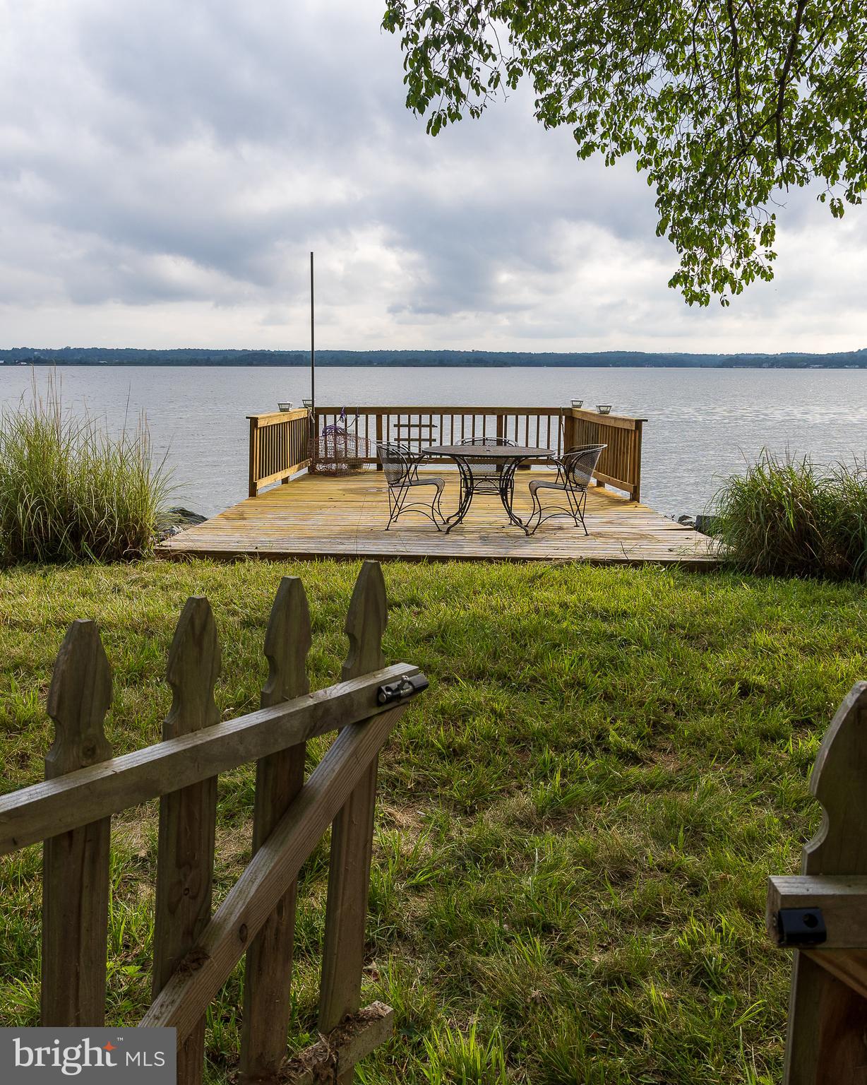 6225 Sandy Point Road Prince Frederick, MD 20678 - Photo 12 of 45 a view of a chair and table on the terrace
