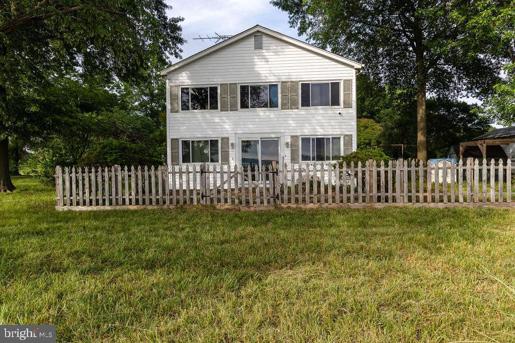 6225 Sandy Point Road Prince Frederick, MD 20678 - Photo 31 of 45 a front view of a house with garden