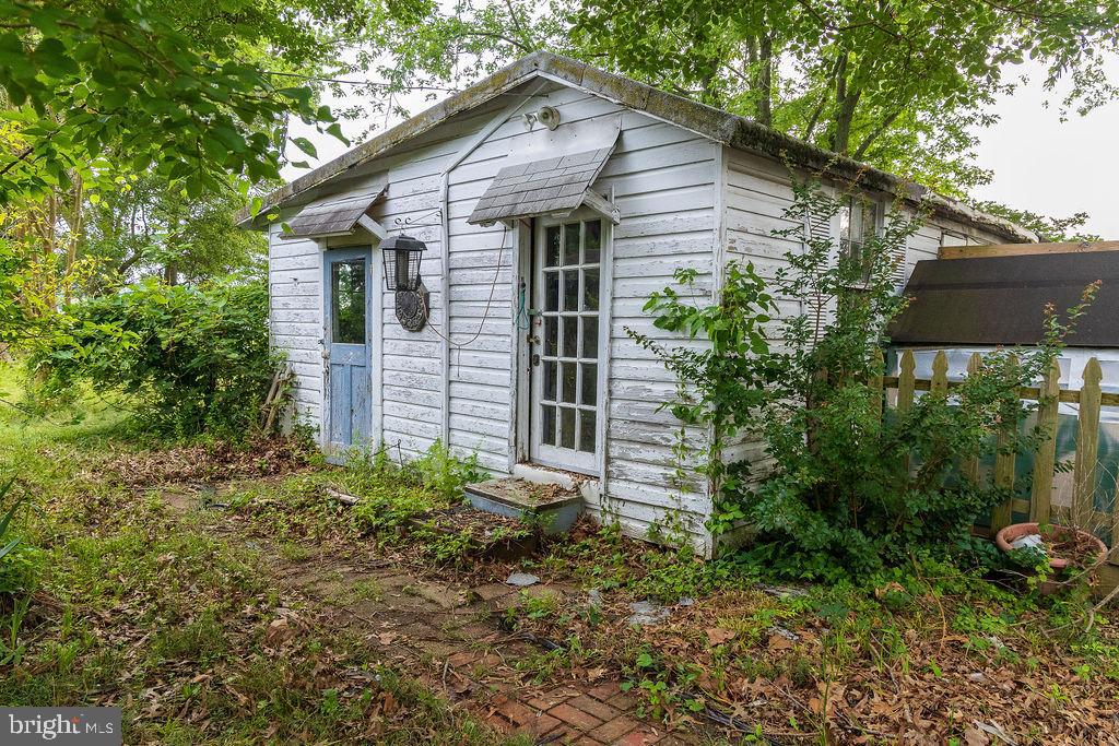 6225 Sandy Point Road Prince Frederick, MD 20678 - Photo 36 of 45 a house that has a tree in front of it