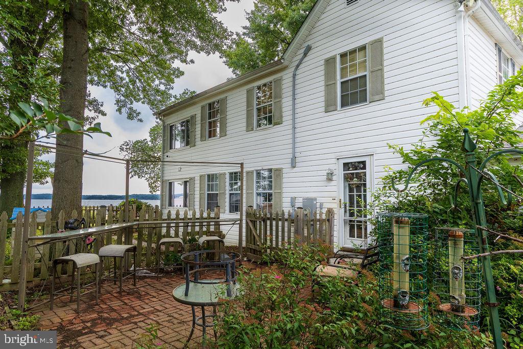 6225 Sandy Point Road Prince Frederick, MD 20678 - Photo 37 of 45 a front view of a house with a garden