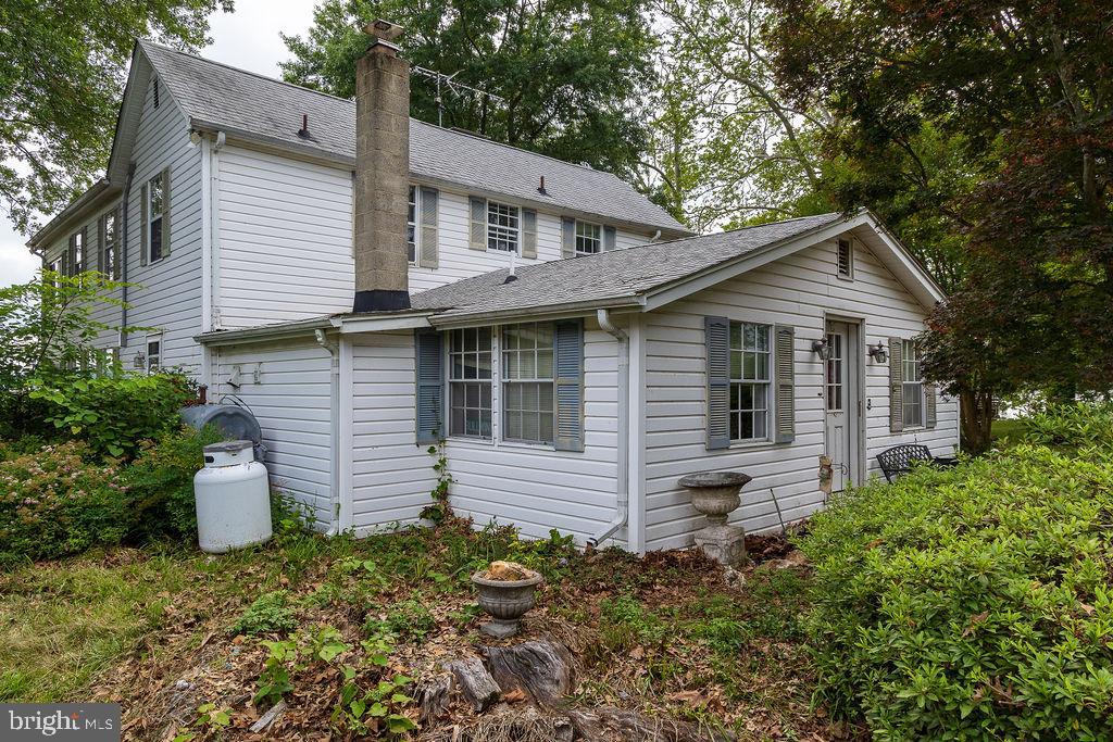 6225 Sandy Point Road Prince Frederick, MD 20678 - Photo 38 of 45 a front view of a house with a garden
