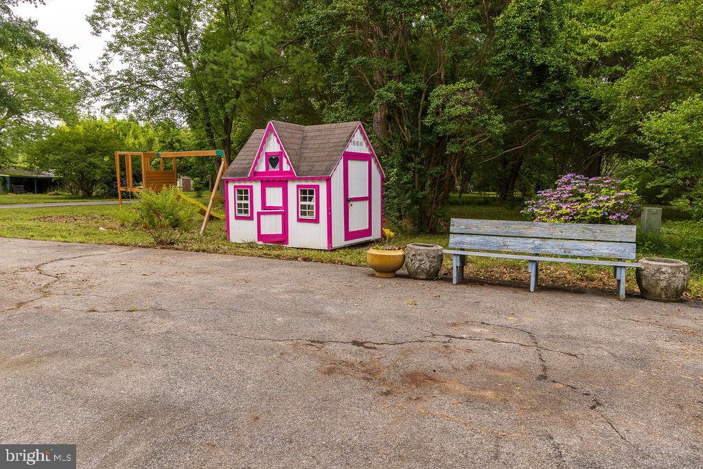 6225 Sandy Point Road Prince Frederick, MD 20678 - Photo 40 of 45 a front view of a house with a yard and garage