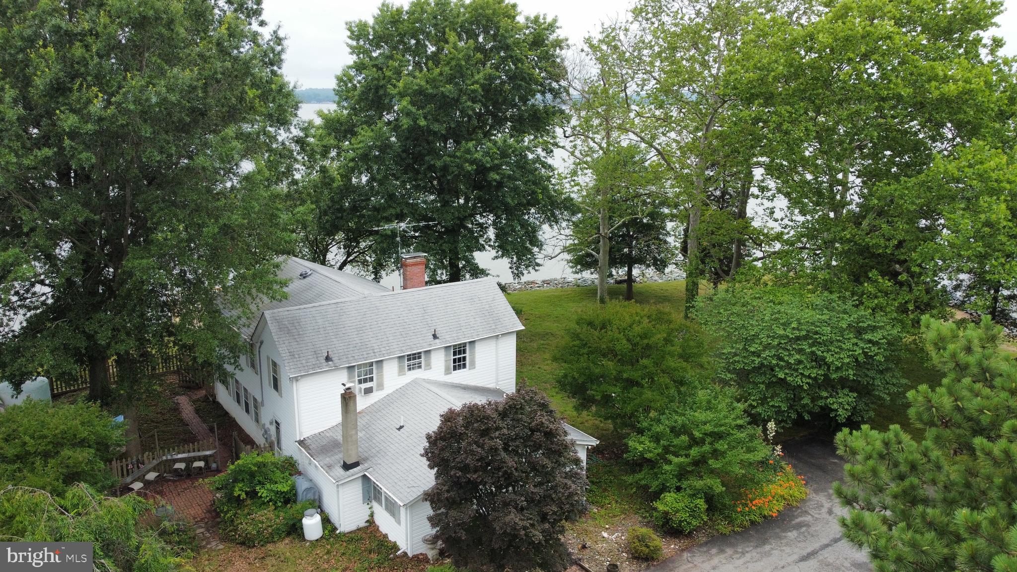 6225 Sandy Point Road Prince Frederick, MD 20678 - Photo 4 of 45 an aerial view of a house with yard and outdoor seating