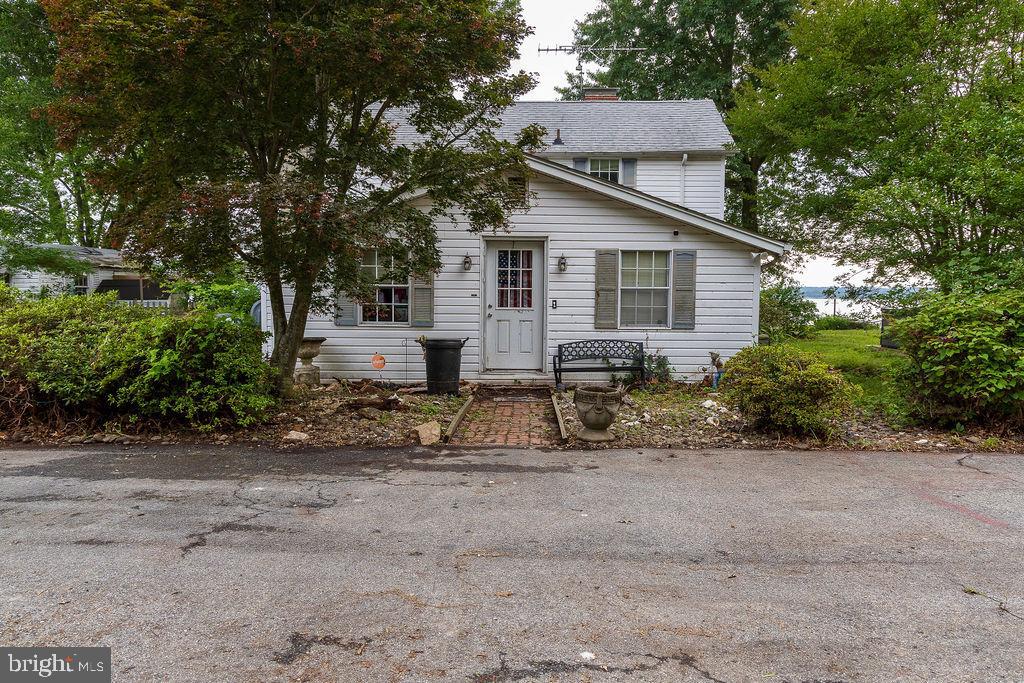 6225 Sandy Point Road Prince Frederick, MD 20678 - Photo 41 of 45 a view of a house with a yard and large trees