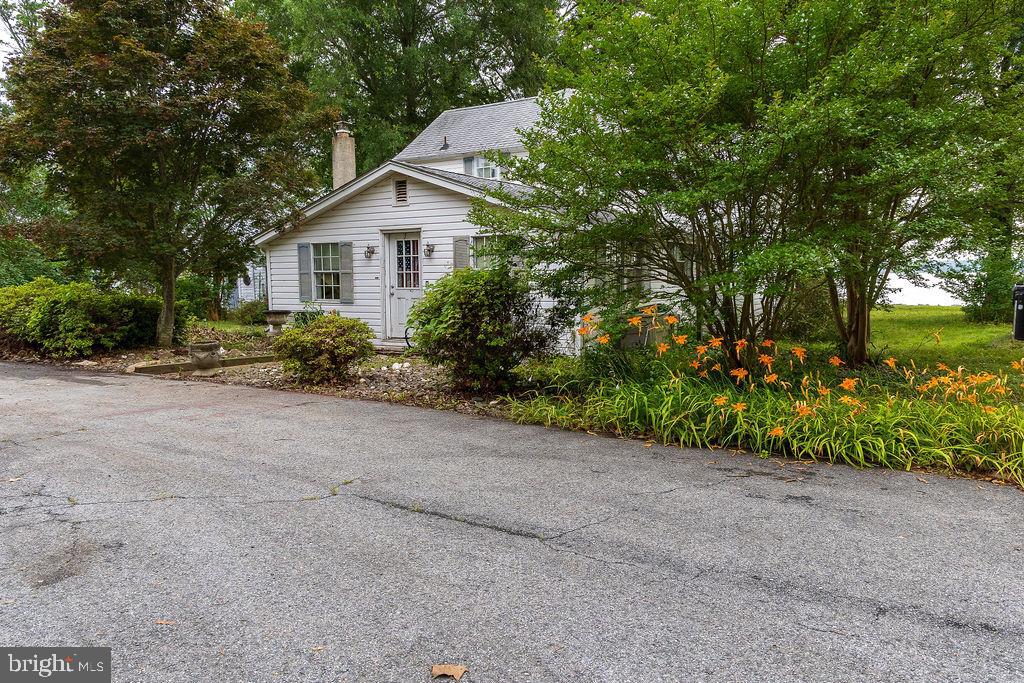 6225 Sandy Point Road Prince Frederick, MD 20678 - Photo 42 of 45 a view of a house with backyard and garden