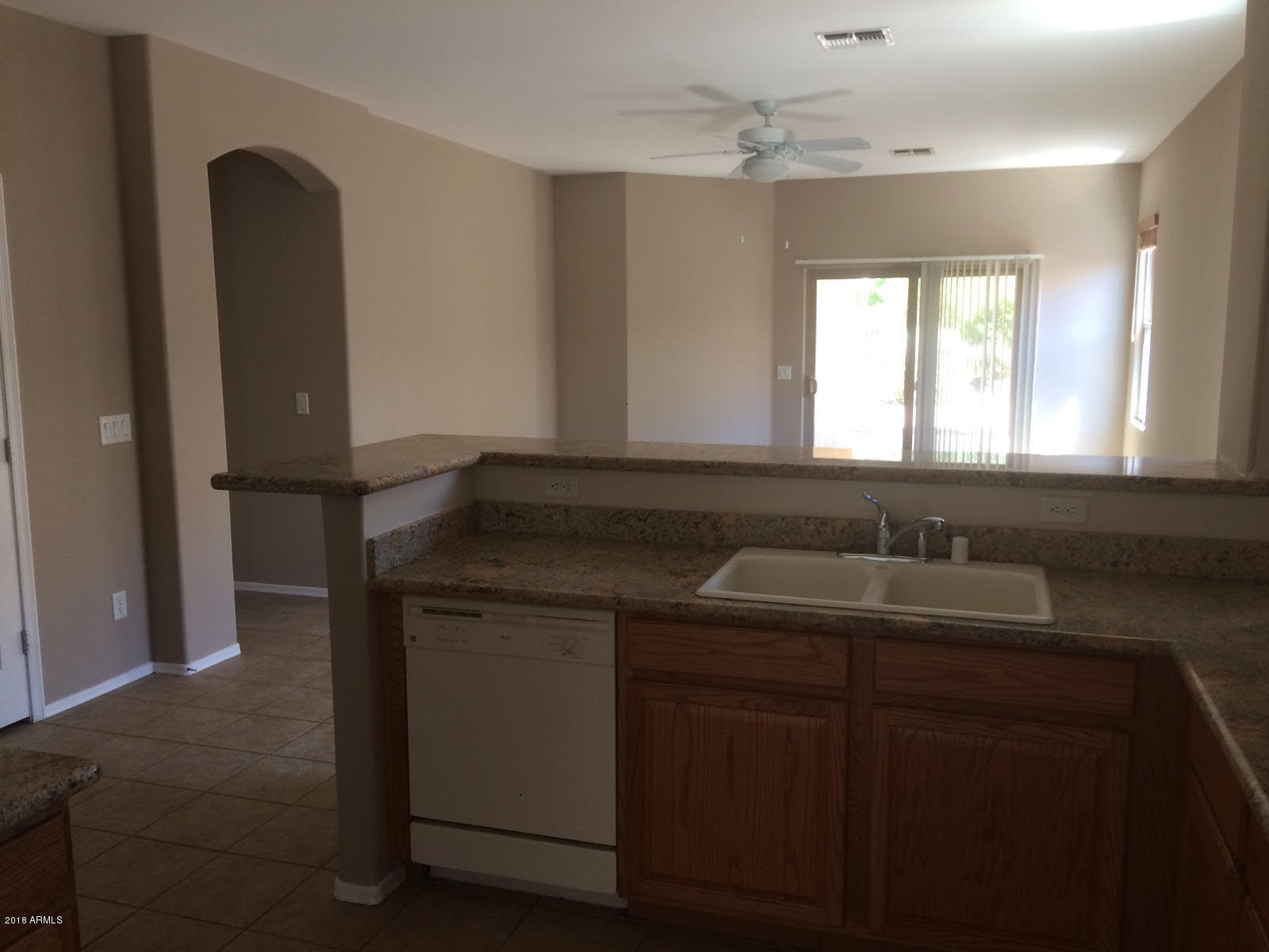 4147 South Bandit Court Gilbert, AZ 85297 - Photo 3 of 4 a kitchen with a sink and a mirror