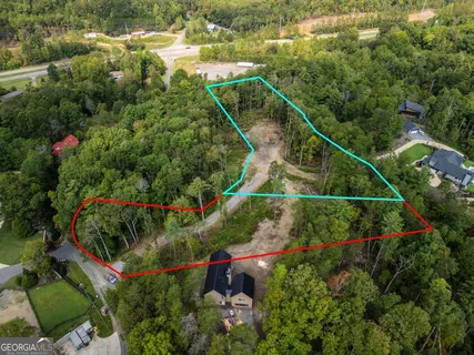 an aerial view of house with swimming pool