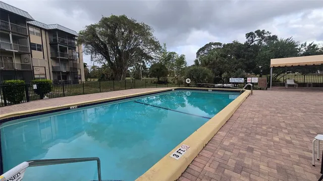 a view of a swimming pool with a patio