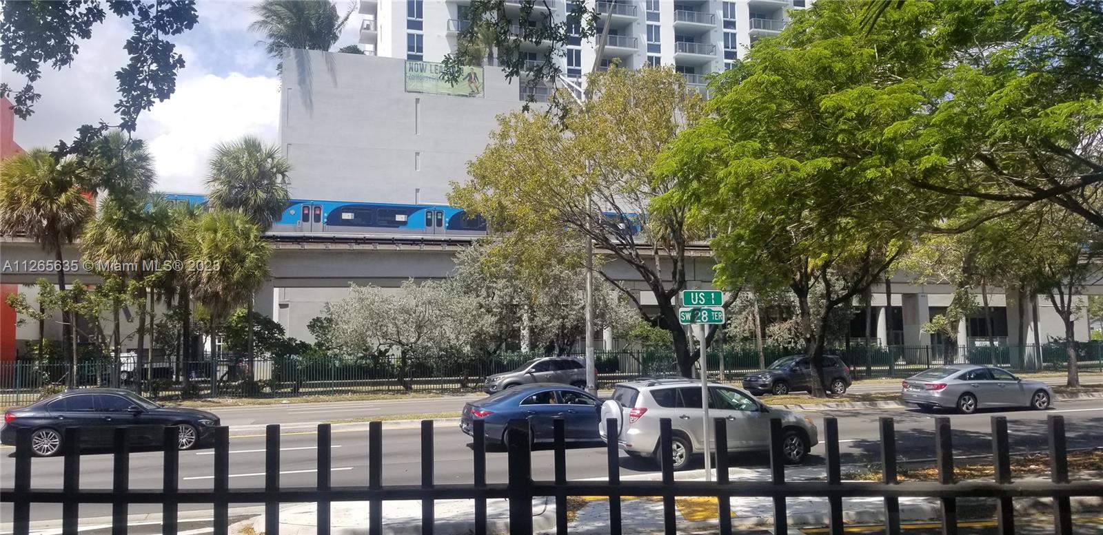 2920 Southwest 28th Terrace, Unit 304 Miami, FL 33133 - Photo 14 of 26 a front view of a house with a garden