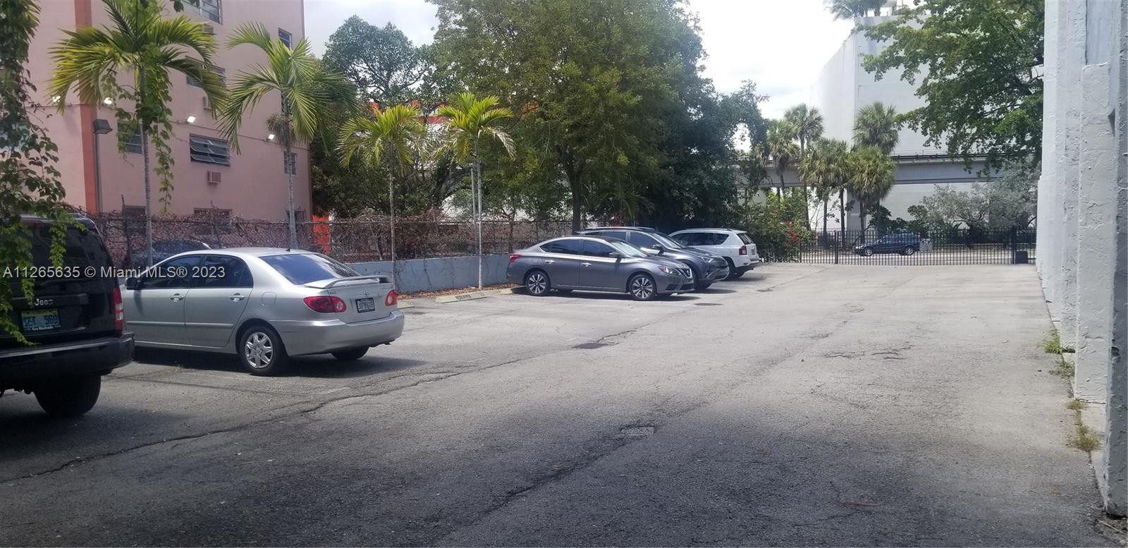 2920 Southwest 28th Terrace, Unit 304 Miami, FL 33133 - Photo 18 of 26 a car parked in front of a house