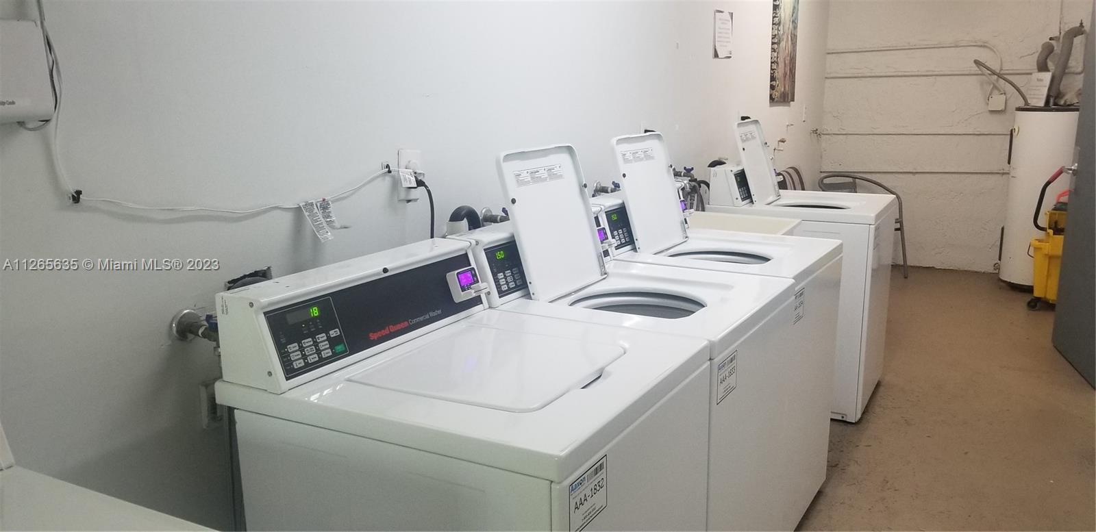 2920 Southwest 28th Terrace, Unit 304 Miami, FL 33133 - Photo 22 of 26 a utility room with dryer and washer