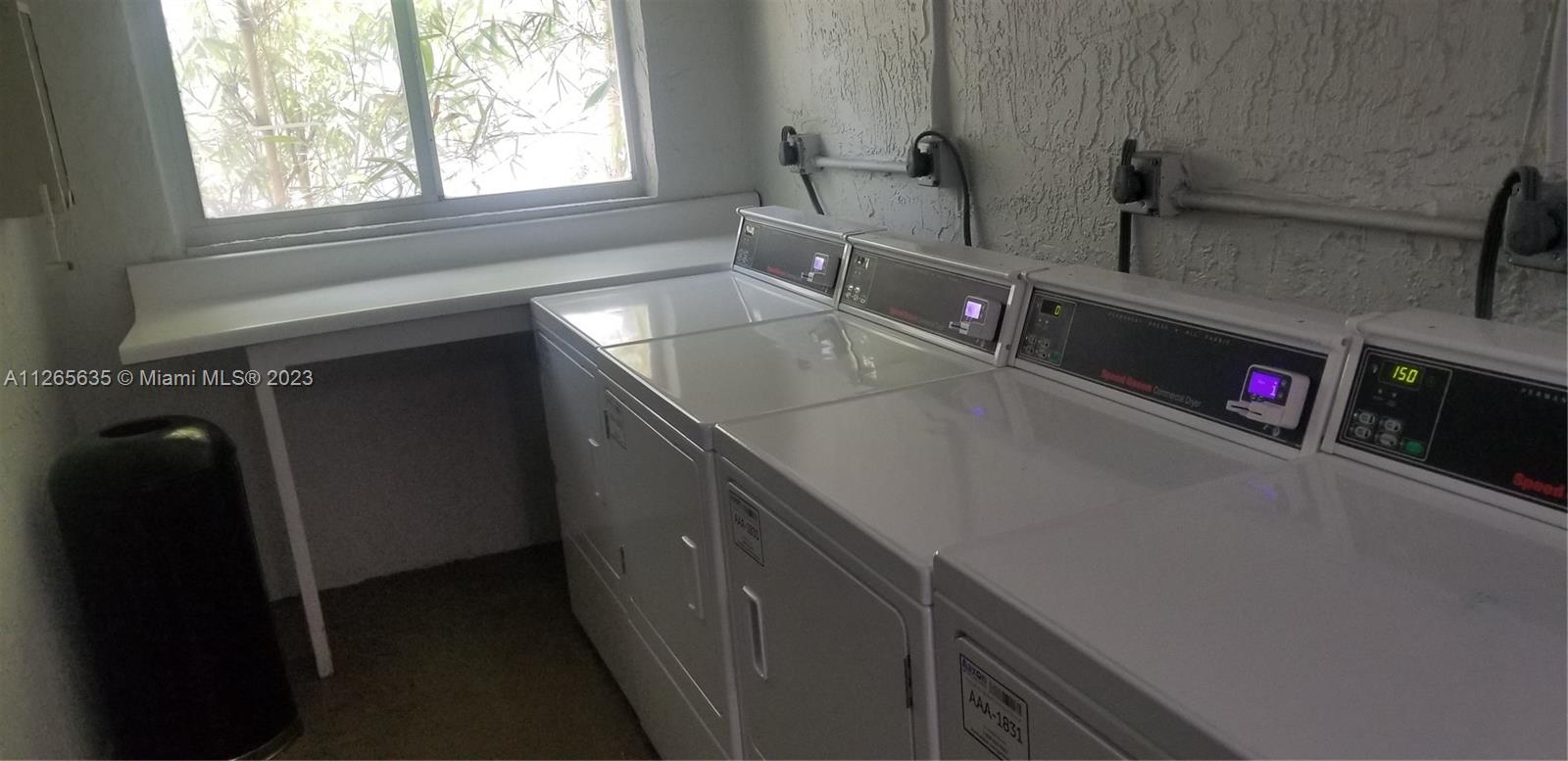 2920 Southwest 28th Terrace, Unit 304 Miami, FL 33133 - Photo 23 of 26 a kitchen with a sink and a window