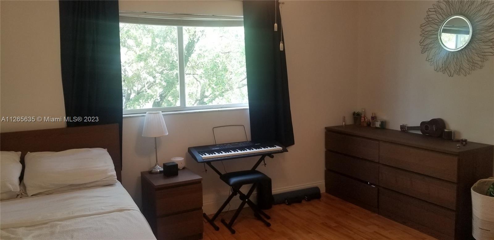2920 Southwest 28th Terrace, Unit 304 Miami, FL 33133 - Photo 5 of 26 a view of a workspace with furniture and a window