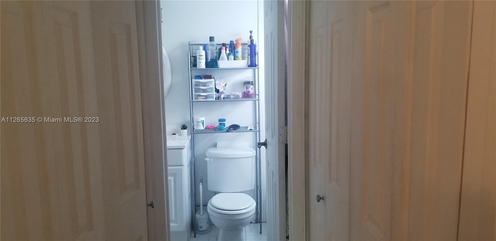 2920 Southwest 28th Terrace, Unit 304 Miami, FL 33133 - Photo 7 of 26 a bathroom with a toilet and a sink