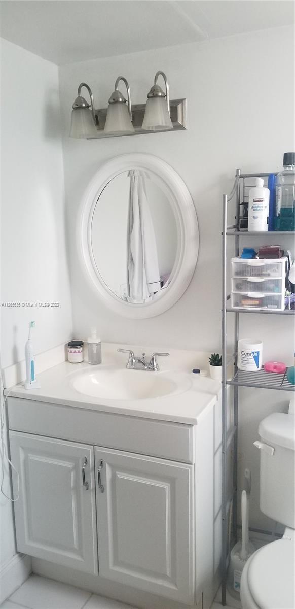 2920 Southwest 28th Terrace, Unit 304 Miami, FL 33133 - Photo 8 of 26 a bathroom with a sink and a toilet