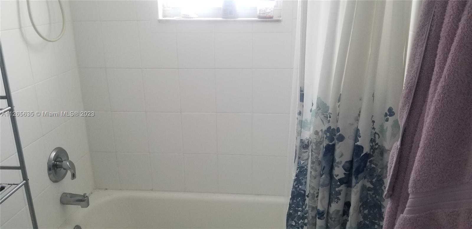 2920 Southwest 28th Terrace, Unit 304 Miami, FL 33133 - Photo 9 of 26 a bathroom with a shower