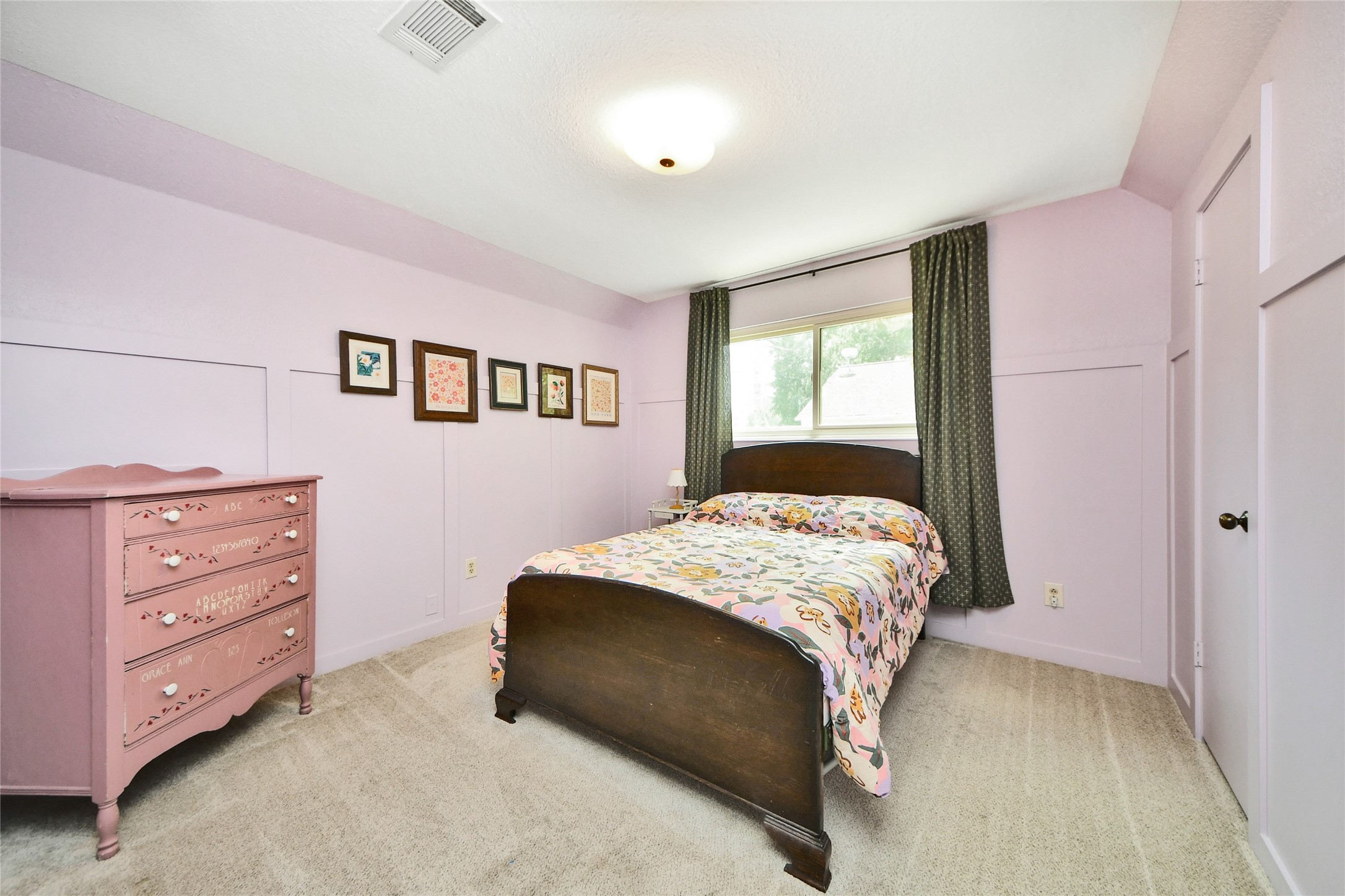3030 Bernadette Lane Houston, TX 77043 - Photo 23 of 31 a bedroom with a bed and a dresser