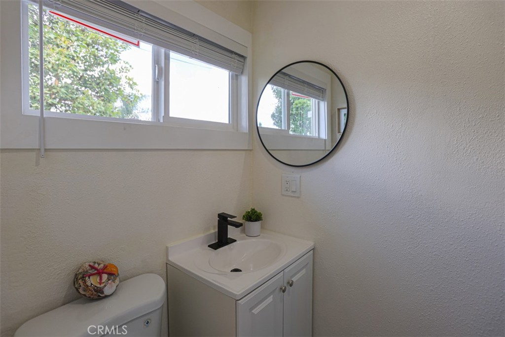 600 South Emily Street Anaheim, CA 92805 - Photo 12 of 22 a bathroom with a sink and a mirror