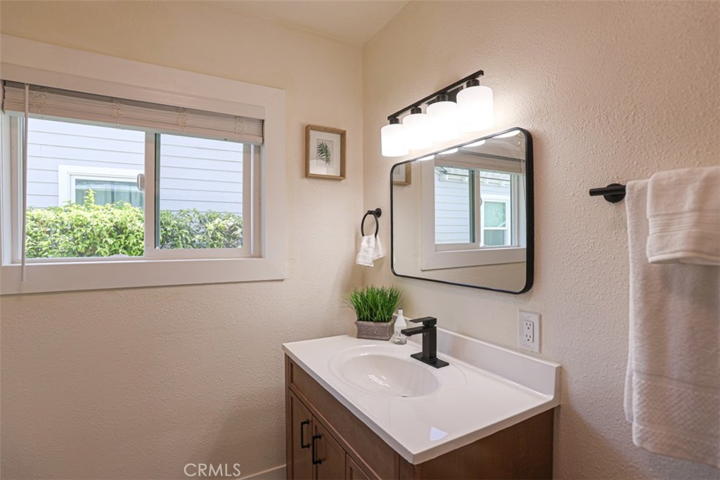 600 South Emily Street Anaheim, CA 92805 - Photo 15 of 22 a bathroom with a sink and a mirror