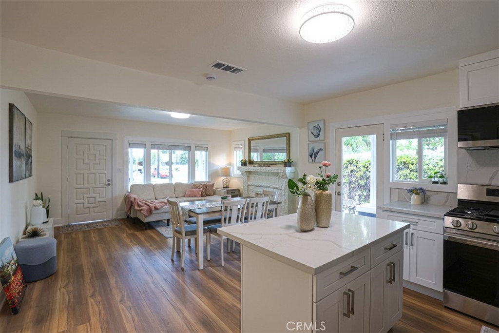 600 South Emily Street Anaheim, CA 92805 - Photo 7 of 22 a kitchen with stainless steel appliances granite countertop a stove and a wooden floors