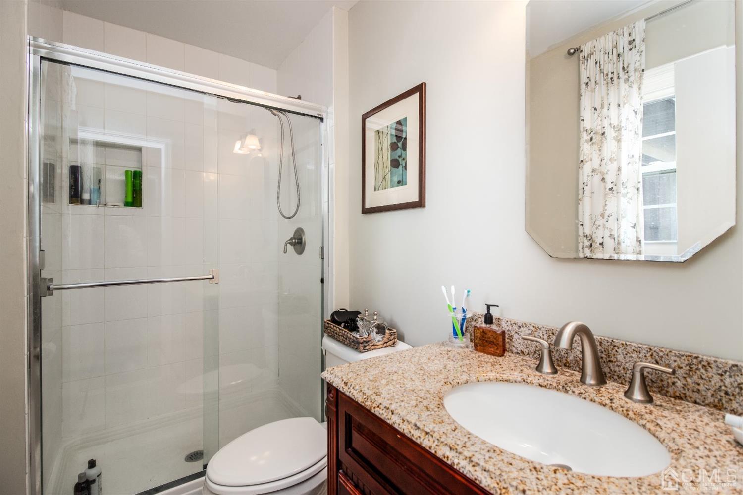 15 Johnson Road Somerset, NJ 08873 - Photo 14 of 26 a bathroom with a granite countertop sink toilet and shower
