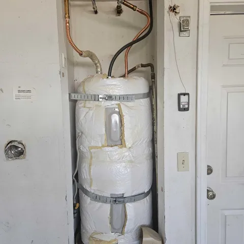 a bathroom with a sink mirror and toilet