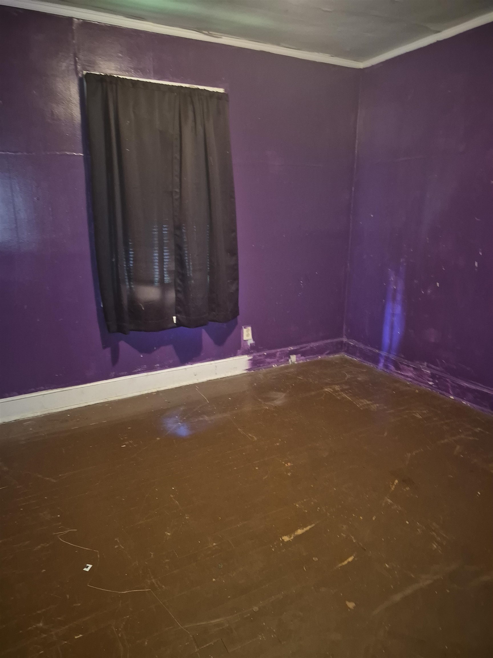 Spare room with baseboards and ornamental molding