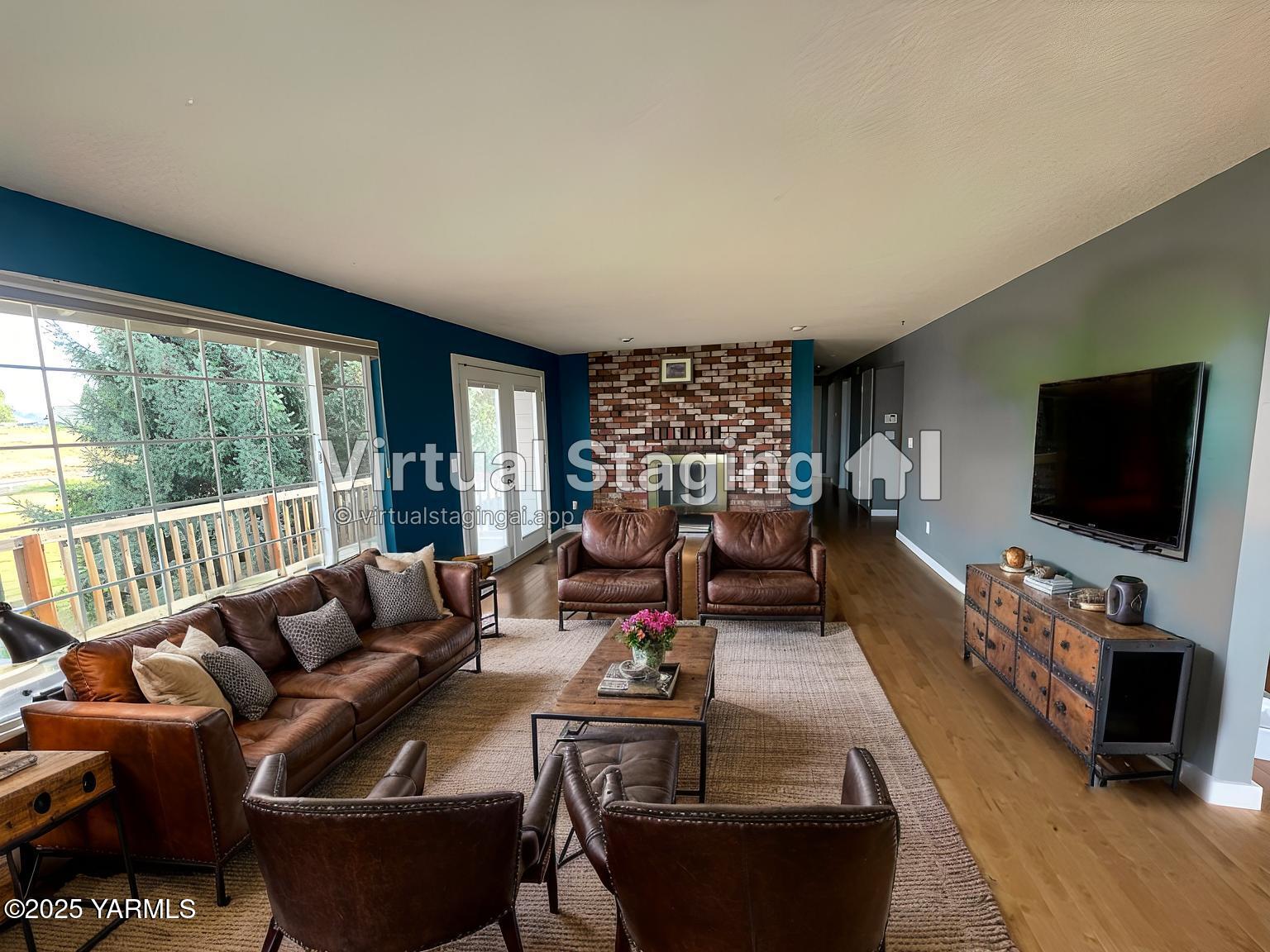 1602 Stein Road Yakima, WA 98908 - Photo 11 of 40 a living room with furniture a flat screen tv and a large window
