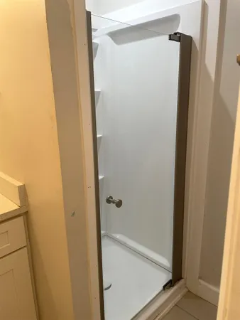 a bathroom with a sink toilet and a mirror