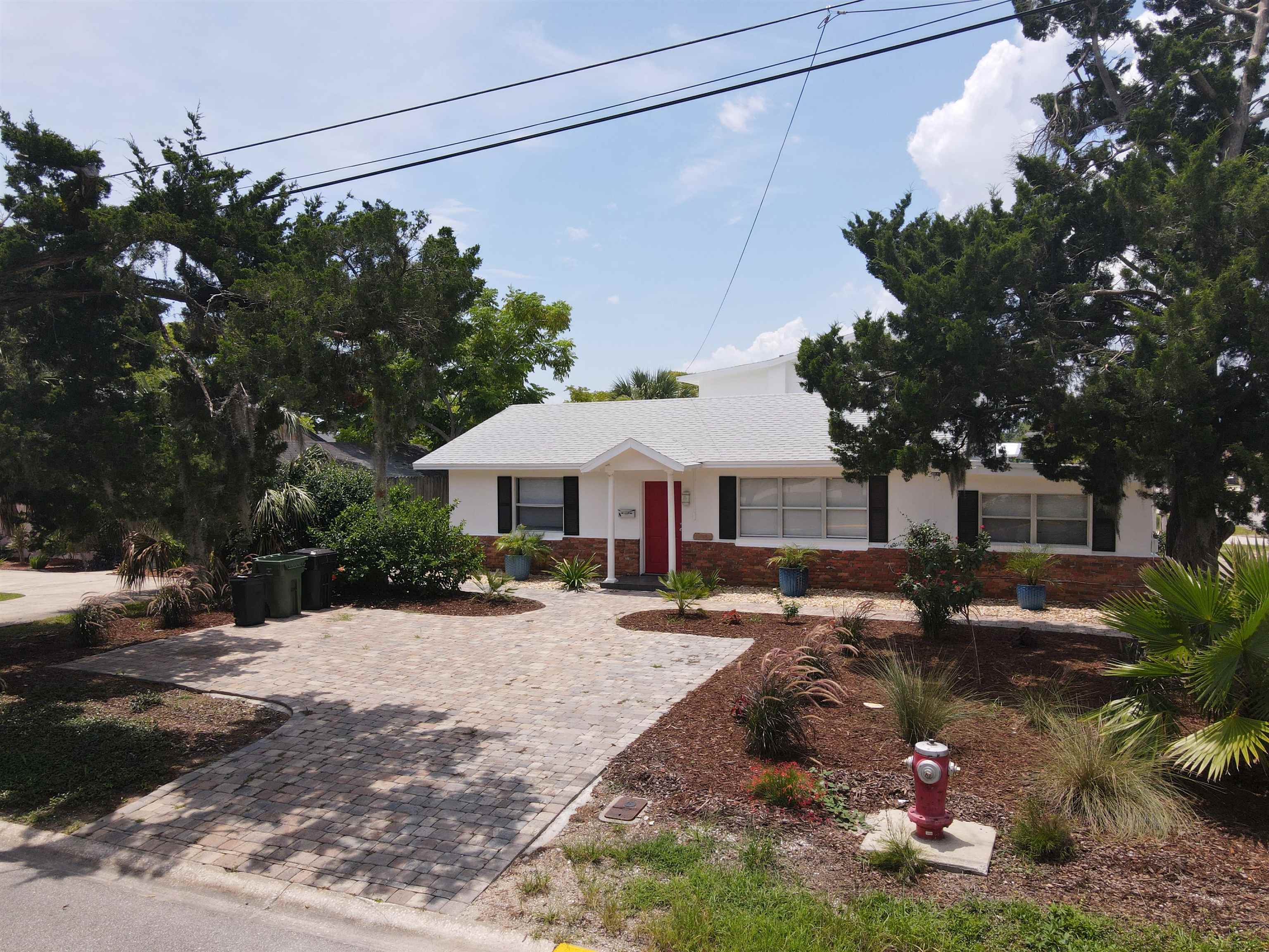101 Flagler Boulevard, Unit A St. Augustine, FL 32080 - Photo 14 of 19 a front view of a house with yard and trees