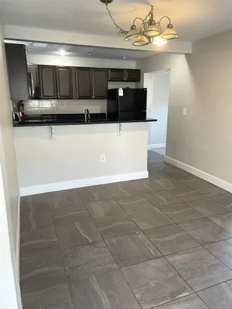 a kitchen with a cabinets and window
