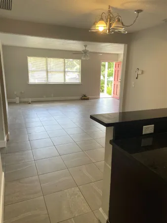 a kitchen with a stove a sink and a microwave
