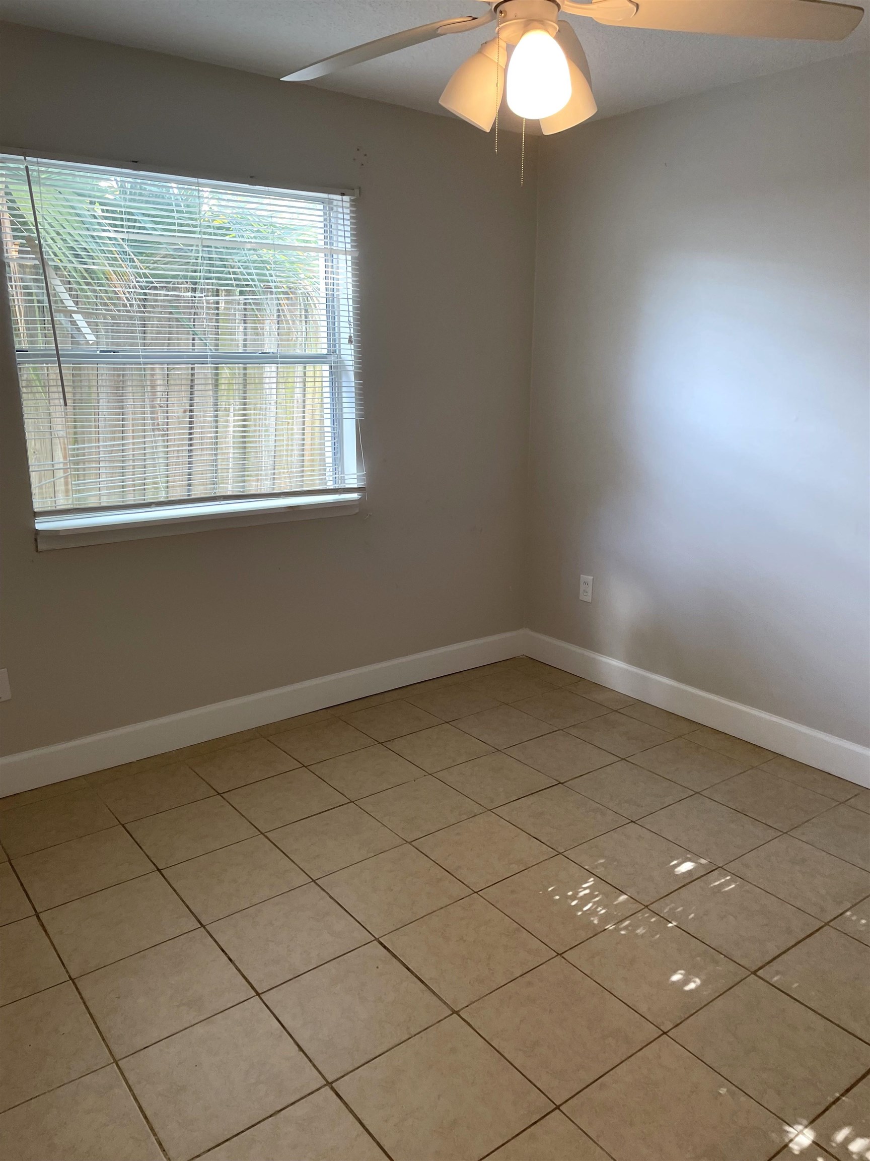 101 Flagler Boulevard, Unit A St. Augustine, FL 32080 - Photo 8 of 19 an empty room with a window