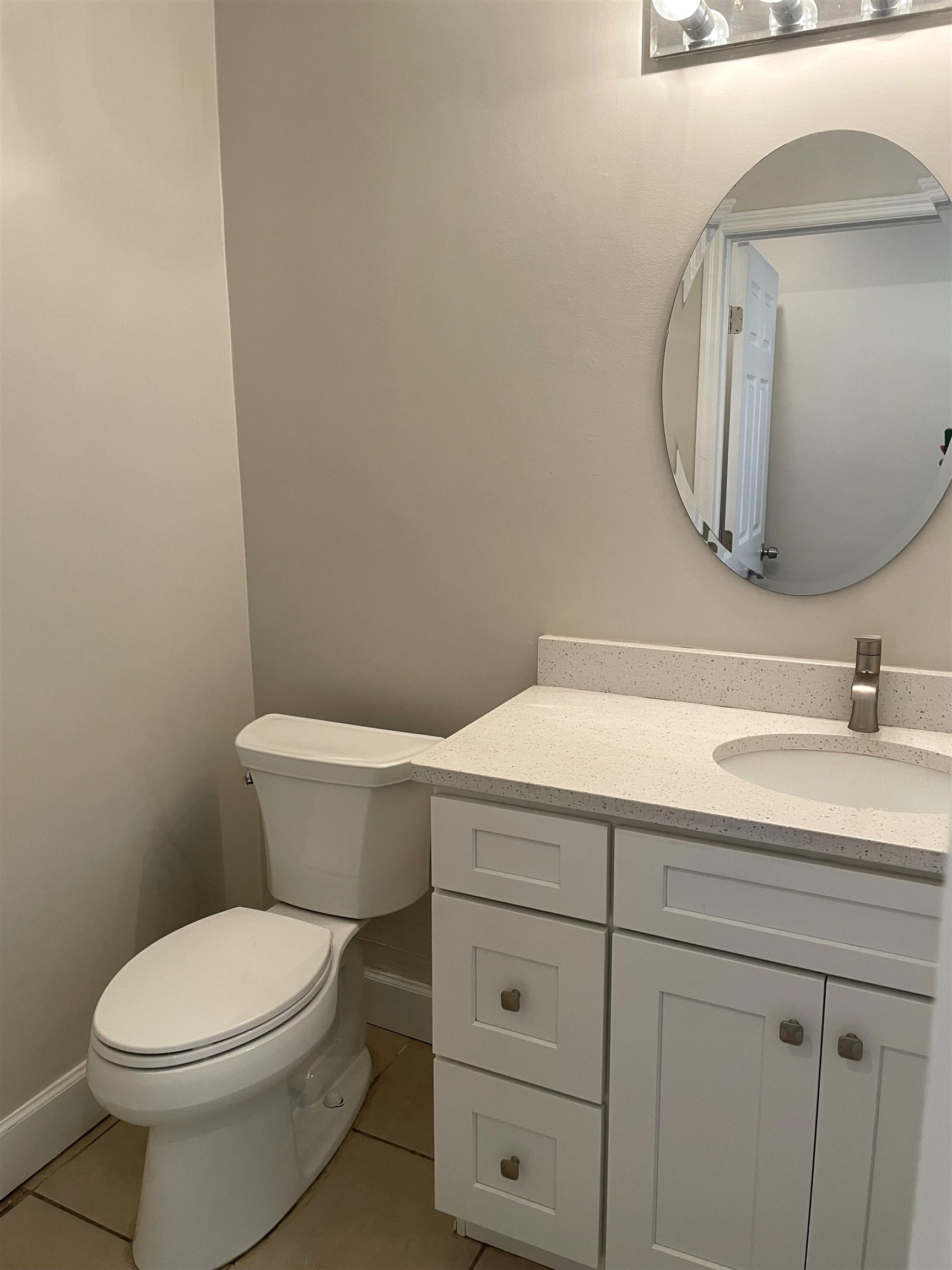 101 Flagler Boulevard, Unit A St. Augustine, FL 32080 - Photo 10 of 19 a bathroom with a toilet sink and mirror