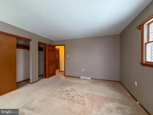 a bathroom with a sink toilet and mirror