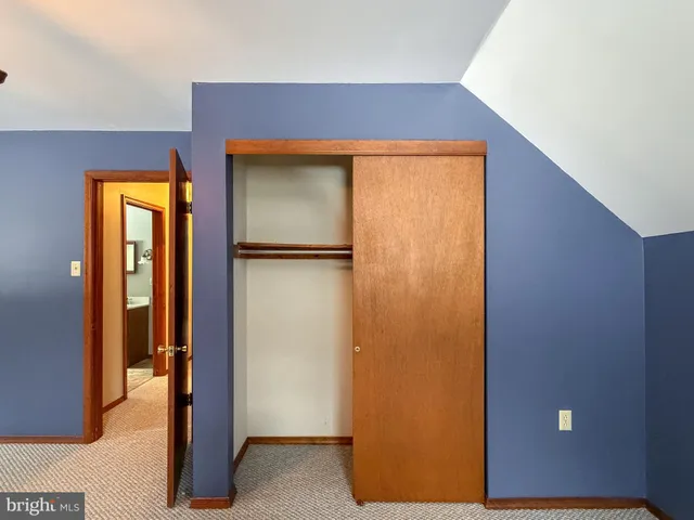 a view of a hallway with closet area